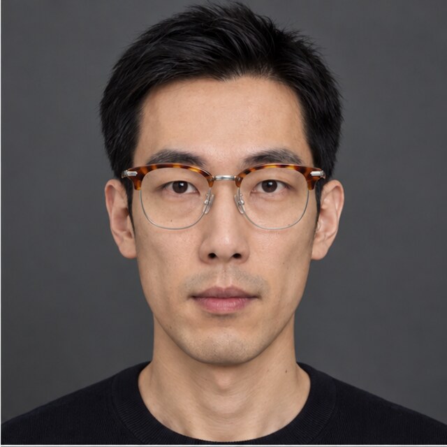 The same long face wearing tortoise browline glasses