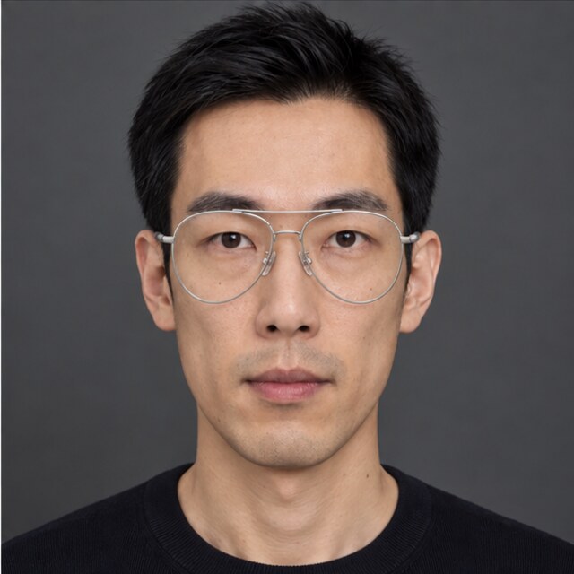 The same long face wearing silver aviator glasses