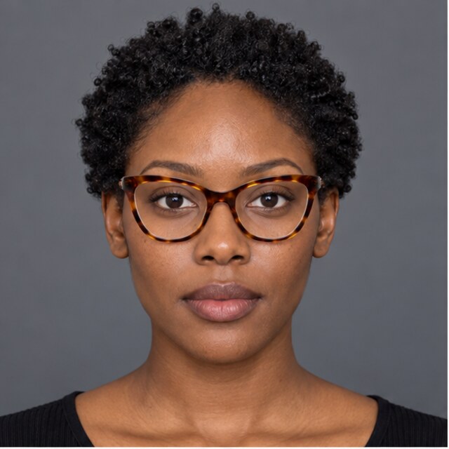 The same oval face wearing tortoise cat-eye glasses