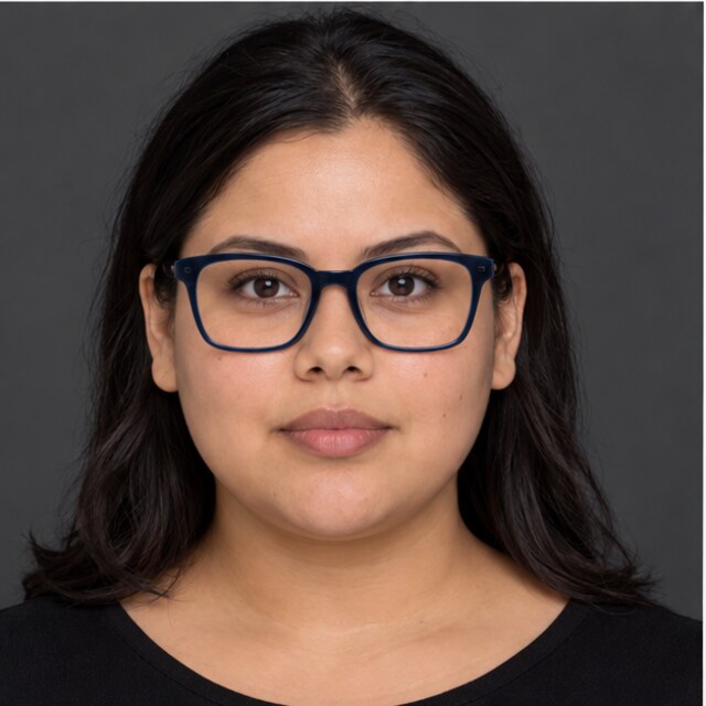 The same round face wearing navy square glasses