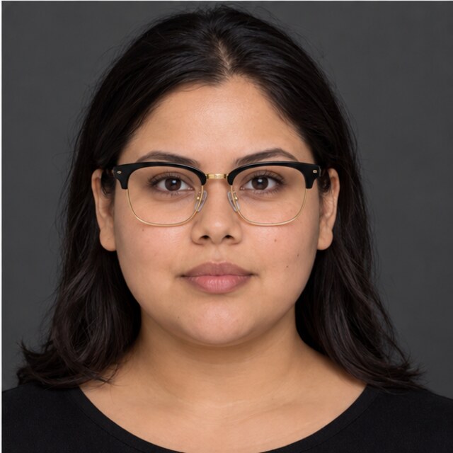 The same round face wearing classic browline glasses