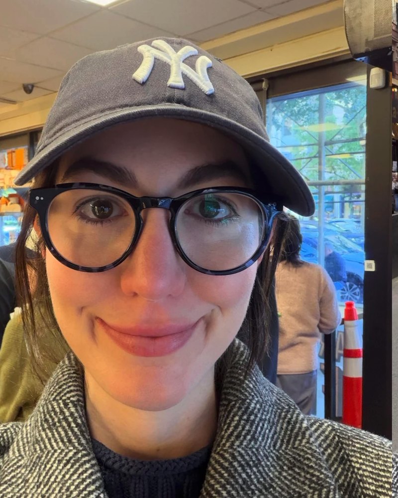 Reddit poster in a cap and round black glasses