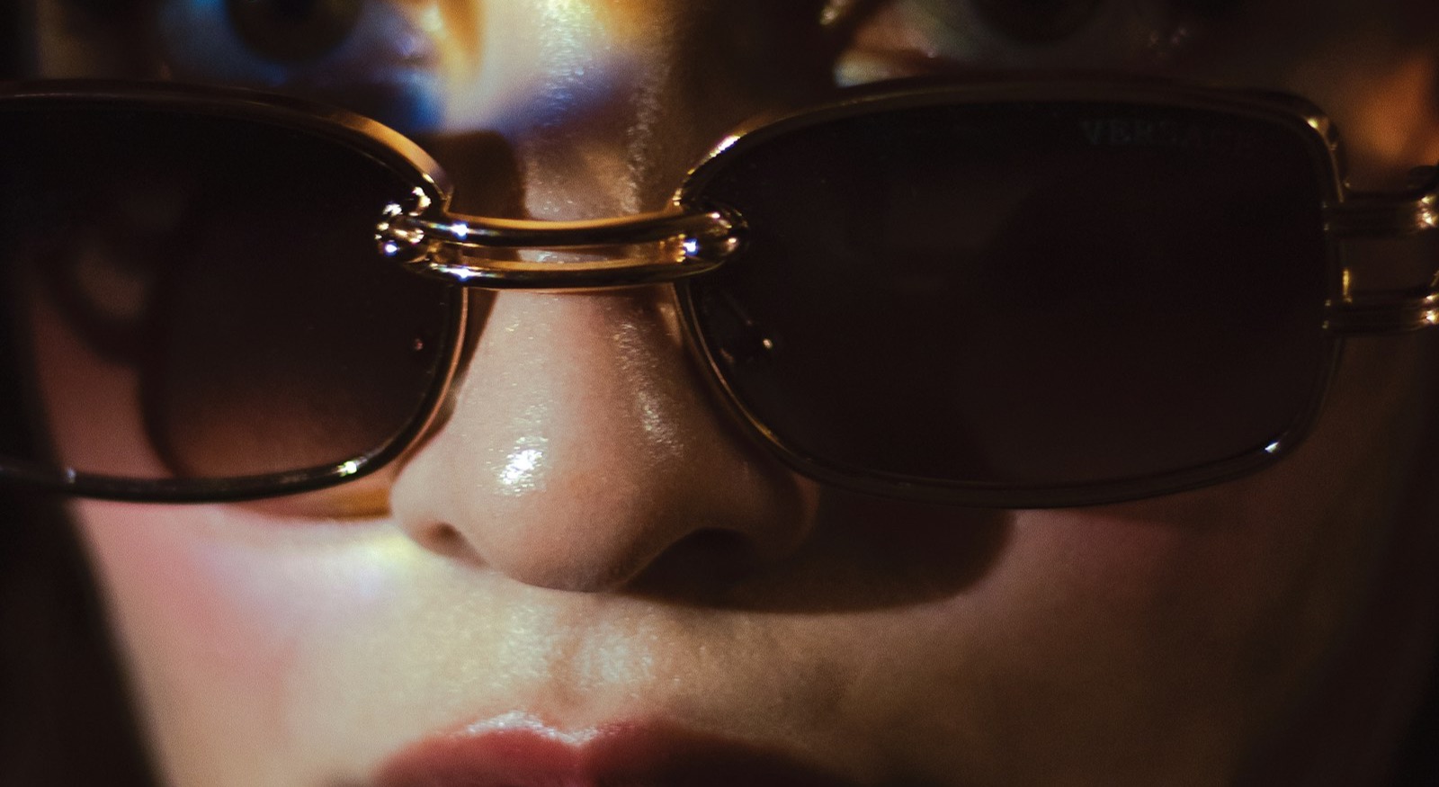 Close-up of sunglasses following the wearer's brow line