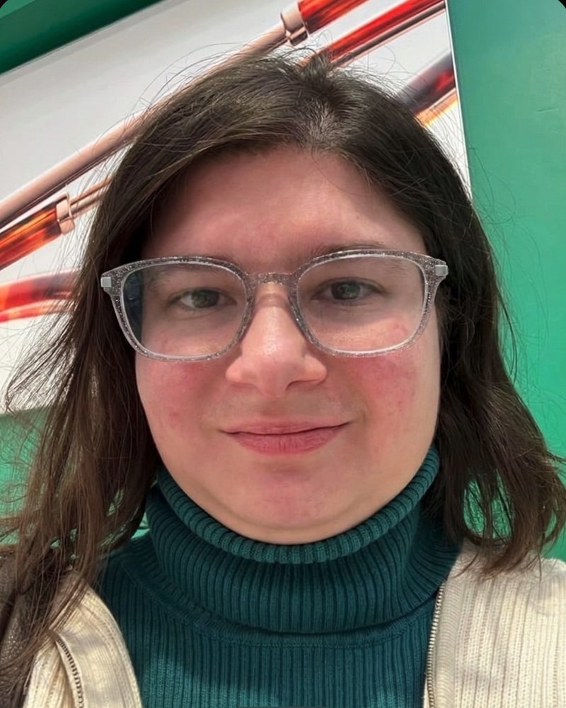 SpecFit try-on of a clear rectangle frame with a slight cat-eye lift
