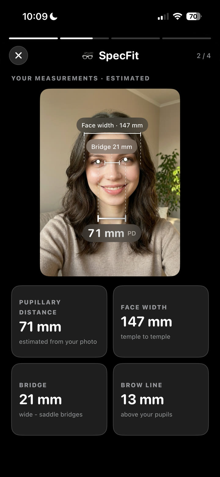 SpecFit measurements card: pupillary distance, face width, bridge and brow line drawn as measurement lines on the user's own photo